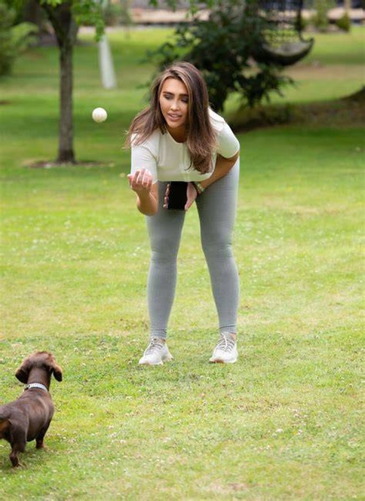 LAUREN GOODGER Playing with Her Do at a Park in Essex 07/27/2020